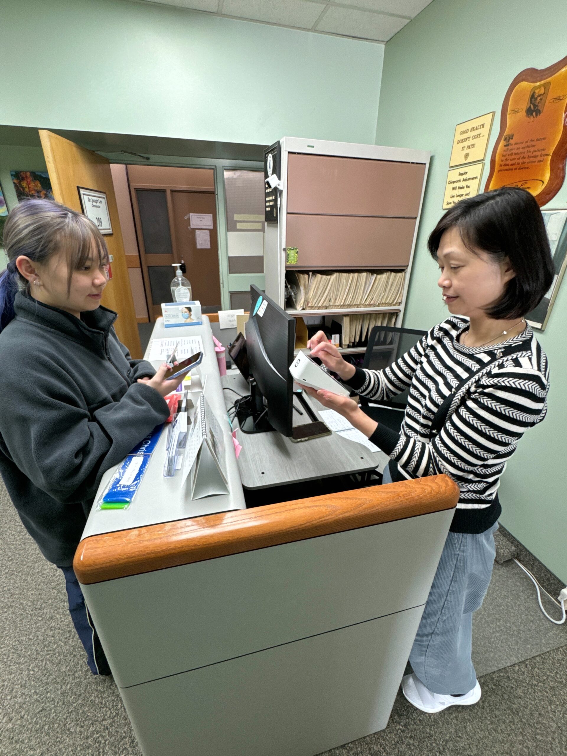 Secretary helping a customer